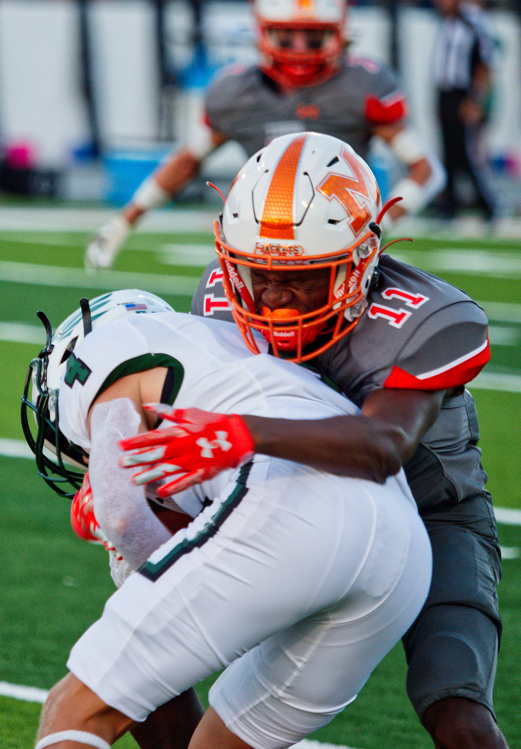 JaMarcus Kennedy wraps up the Canton ball carrier Friday night for Mineola.  [find more football photos]